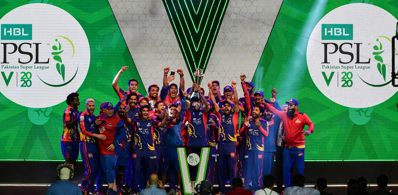 Karachi Kings' cricketers celebrate with the trophy after winning the Pakistan Super League (PSL) Twenty20 cricket final match. Credit: AFP Photo