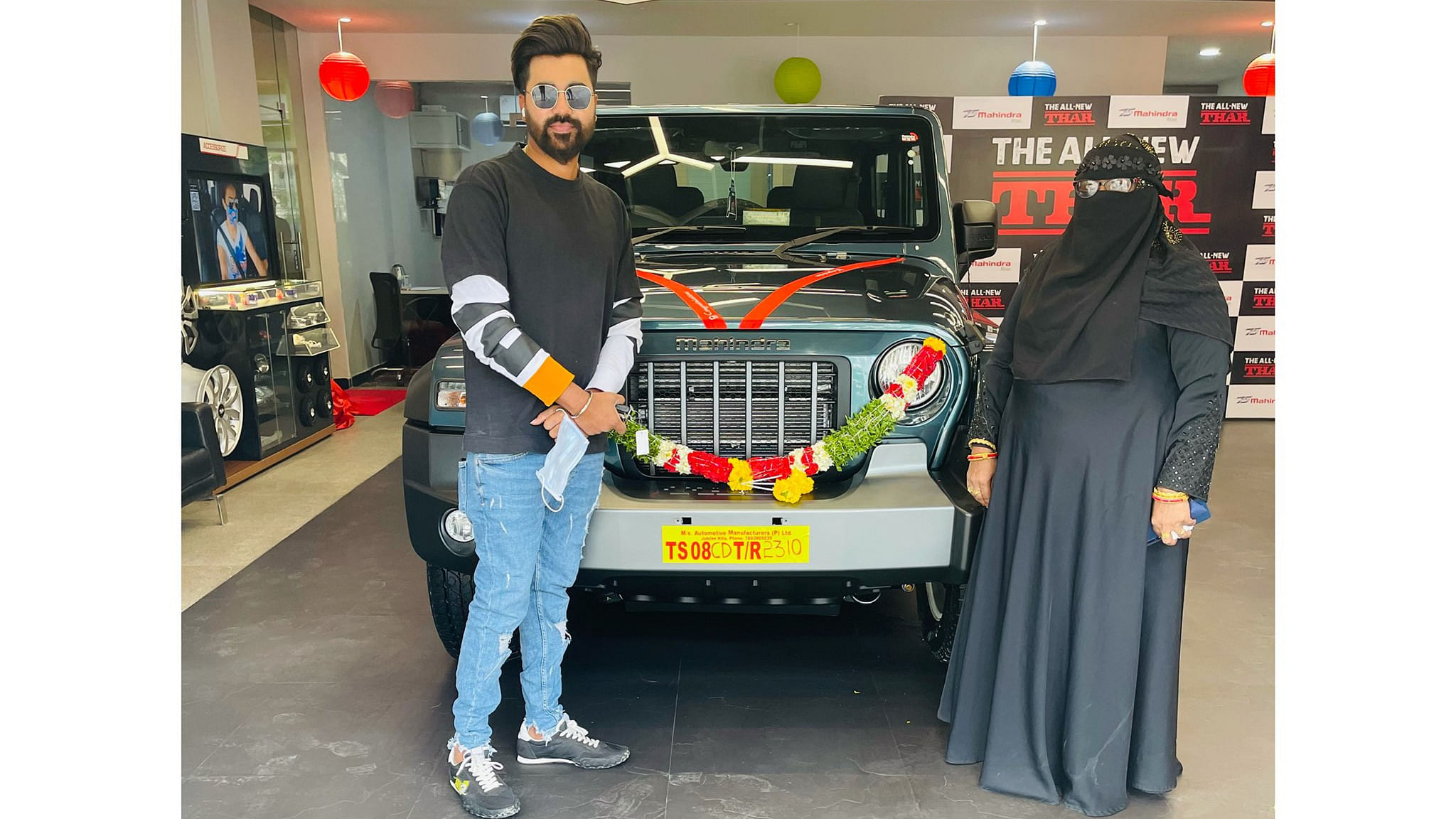 Mohammed Siraj took to social media to thank Anand Mahindra for the gesture and also shared a picture of his brother and mother receiving the car since he was on IPL duty. Credit: Twitter/ @mdsirajofficial 