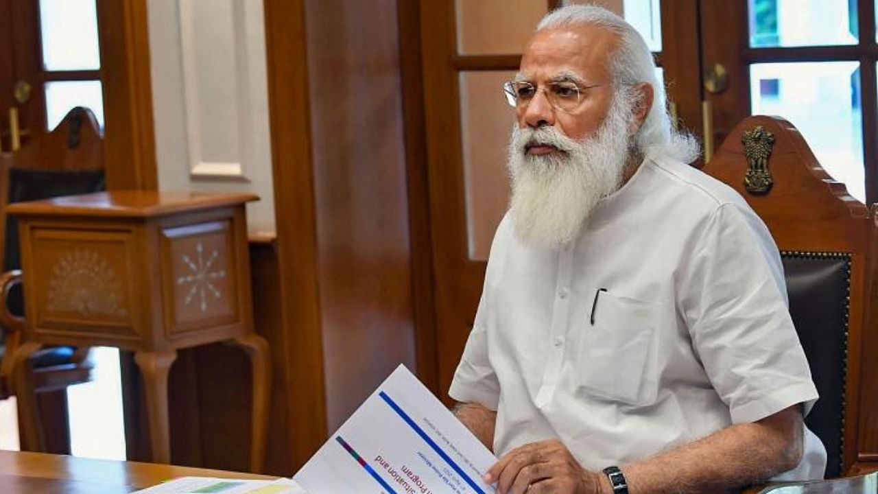 Prime Minister Narendra Modi at a high-level meeting to review the Covid-related issues and vaccinations happening in the country. Credit: PTI.