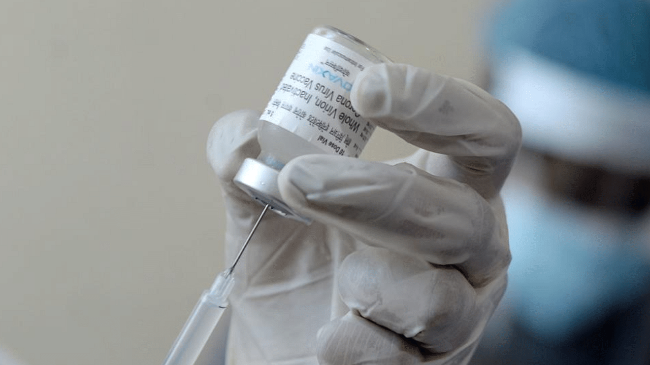 A medical worker prepares to inoculate a person with the Covaxin Covid-19 coronavirus vaccine, at a government hospital. Credit: AFP Photo