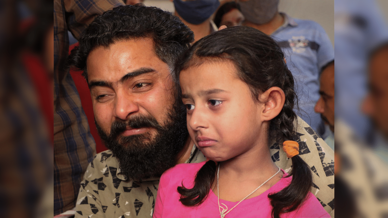 Brother and daughter of Rakeshwar Singh Manhas, a Cobra Commando missing from the Bastar encounter site with the naxals in Chhattisgarh, in Jammu, Monday , April 5, 2021. Credit: PTI Photo