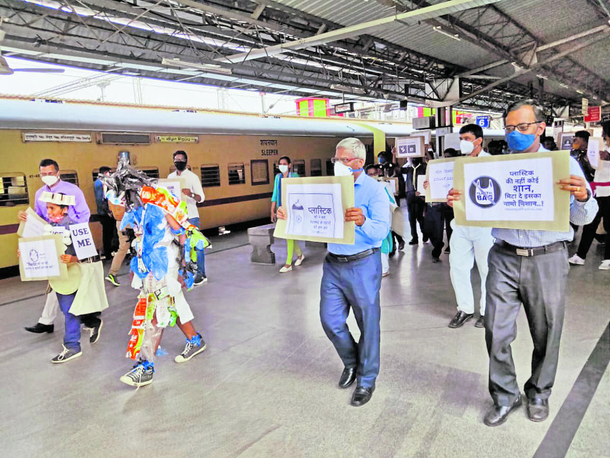 Railway employees create awareness against the use of plastic at the city railway station in Mysuru on Monday. DH PHOTO