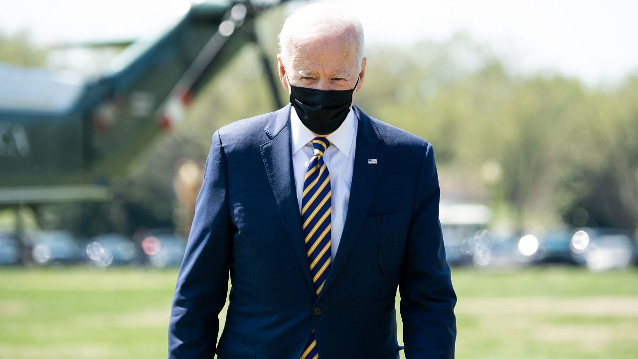 US President Joe Biden disembarks from Marine One upon arrival at the Ellipse near the White House in Washington, DC, April 5, 2021, following a weekend trip to Camp David. Credit: AFP.
