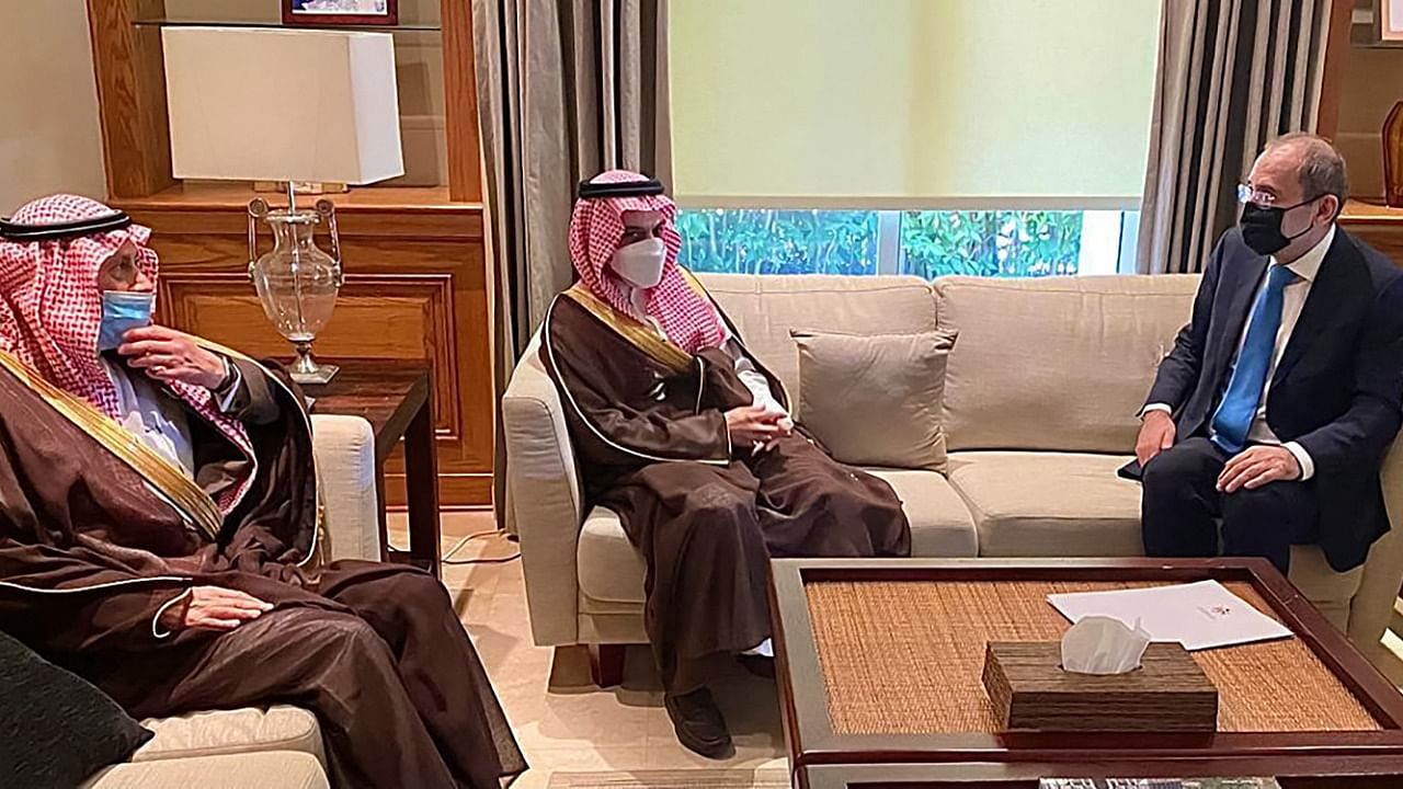 A handout picture released by the Jordanian Foreign Ministry on April 6, 2021 shows Jordan's Foreign Minister Ayman Safadi (R) meeting with his Saudi counterpart Faisal bin Farhan Al-Saud (C) in the capital Amman. Credit: Jordanian Foreign Ministry / AFP.