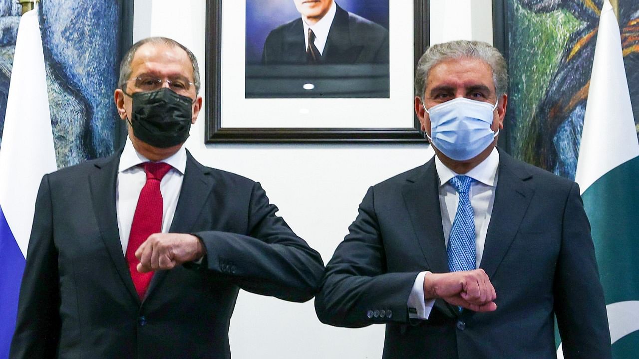 In this handout photo released by Russian Foreign Ministry Press Service, Russian Foreign Minister Sergey Lavrov, left, and Pakistani Foreign Minister Shah Mahmood Qureshi pose for a photo prior to their talks in Islamabad. Credit: AP/PTI.