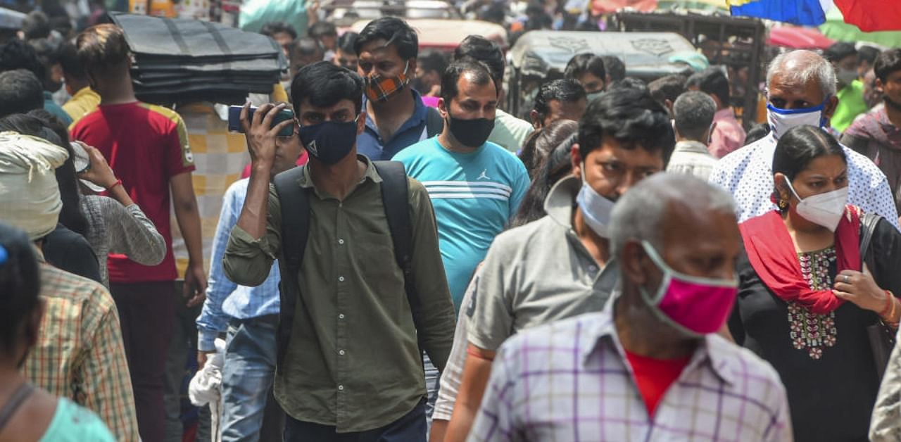 People, not adhering to social distancing norms, at Sadar Bazar, amid coronavirus pandemic, in New Delhi, Wednesday, April 7, 2021. Credit: PTI Photo