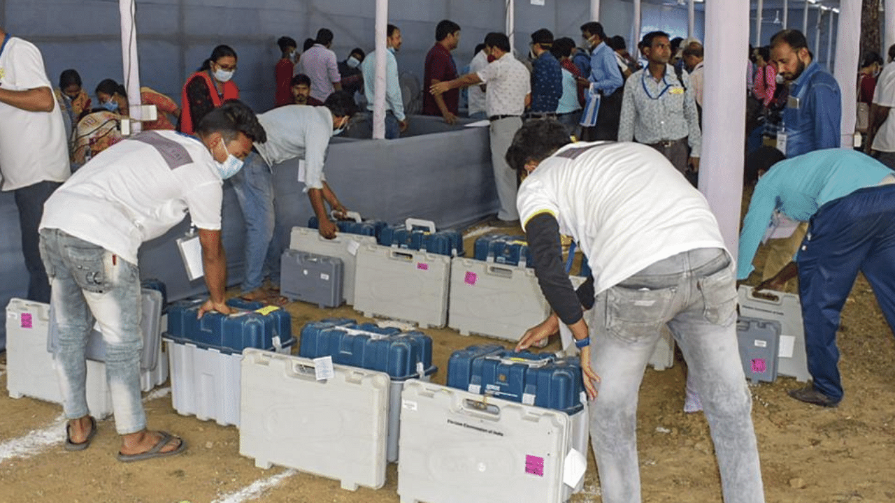 Workers arrange EVMs and other election material at a distribution centre, on the eve of the first phase of Assembly polls, in Bankura, Friday, March 26, 2021. (PTI Photo) 