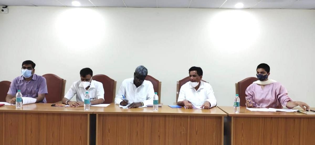 Minister Kota Srinivas Poojary holds a review meeting in Madikeri.