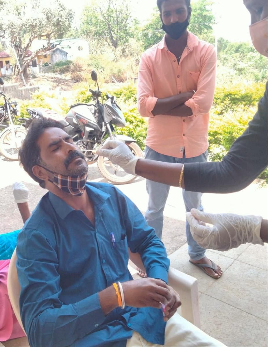 Temple employees undergo Covid tests at B R Hill, Yalandur taluk, Chamarajanagar district. DH PHOTO