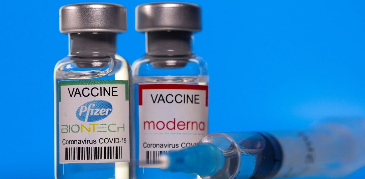 Vials of the Pfizer (L) and Moderna vaccines. Credit: Reuters Photo