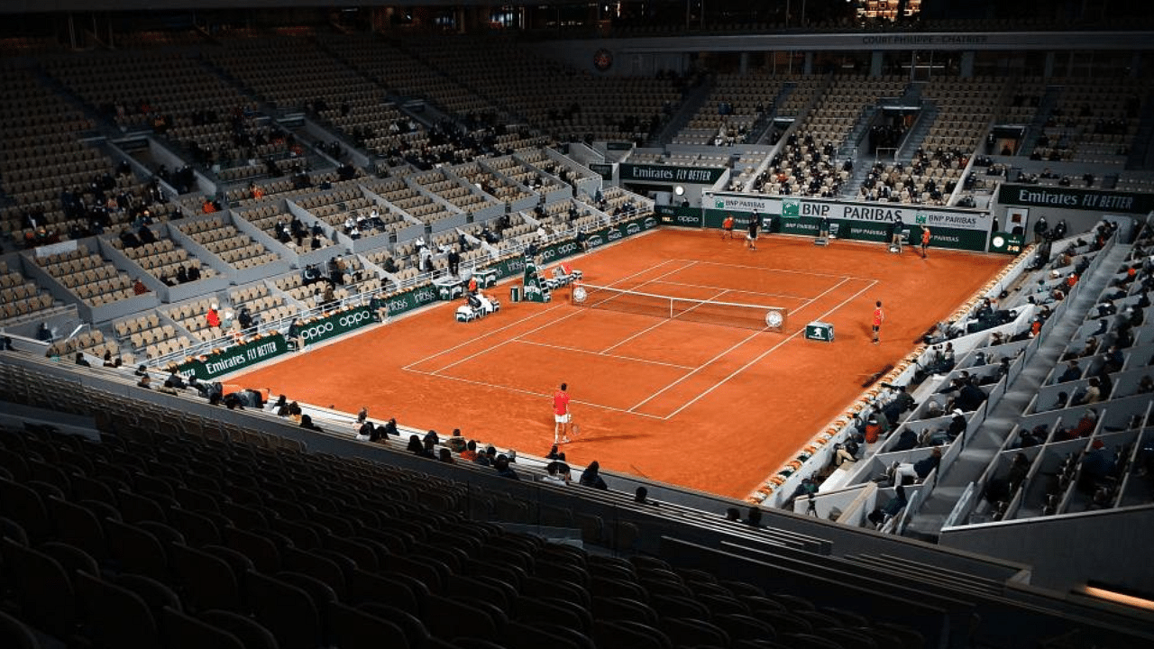 This file photo taken on October 9, 2020, shows a general view at night of the Philippe Chatrier court during the men's singles semi-final tennis match between Serbia's Novak Djokovic and Greece's Stefanos Tsitsipas on Day 13 of The Roland Garros 2020 French Open tennis tournament in Paris.  Credit: AFP File Photo