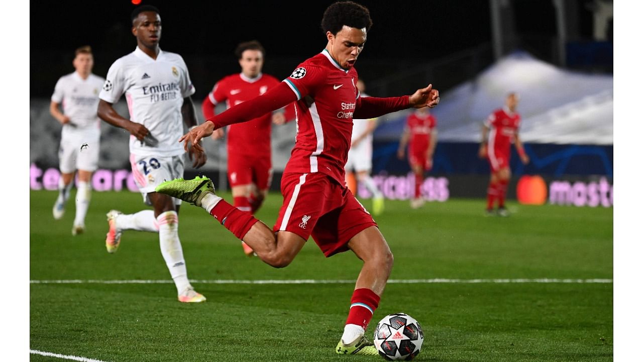 Liverpool's English defender Trent Alexander-Arnold prepares to kick the ball during the UEFA Champions League first leg quarter-final football match between Real Madrid and Liverpool at the Alfredo di Stefano stadium in Valdebebas in the outskirts of Madrid on April 6, 2021. Credit: AFP Photo