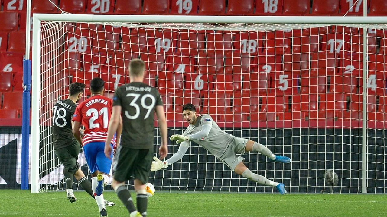 Manchester United's Portuguese midfielder Bruno Fernandes scores a penalty during the UEFA Europa League football match against Granada FC. Credit: AFP Photo