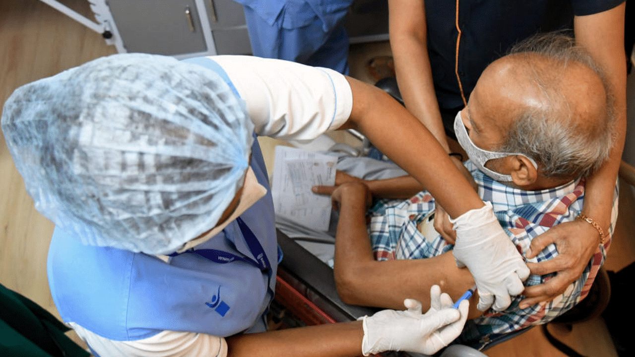 A medical worker vaccinates a man with Covid-19 vaccine at Ramaiah Memorial Hospital, Bengaluru on Thursday, April 08, 2021. DH Photo/Pushkar V