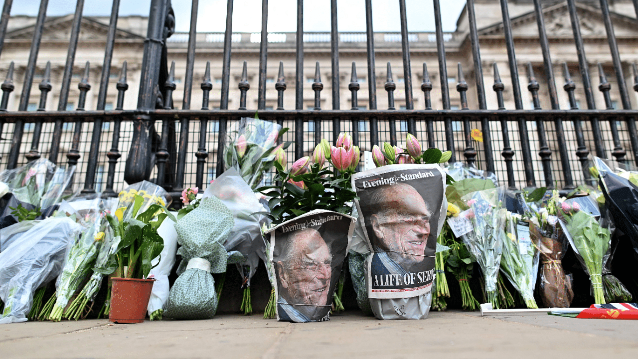 Floral tributes are pictured at the gates of Buckingham Palace in central London on April 9. Credit: AFP Photo