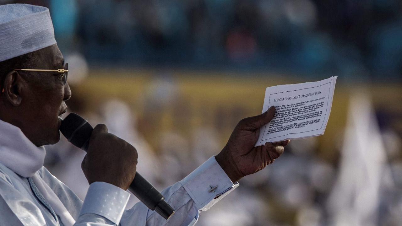 Chadian President Idriss Deby Itno reads from his notes as he addresses supporters at his election campaign rally in N'Djamena on April 9, 2021 ahead of the Presidential election. Credit: AFP Photo
