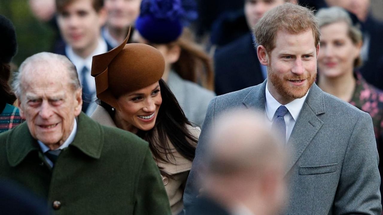 Prince Philip, grandson Harry and Meghan Markle. Credit: AFP Photo