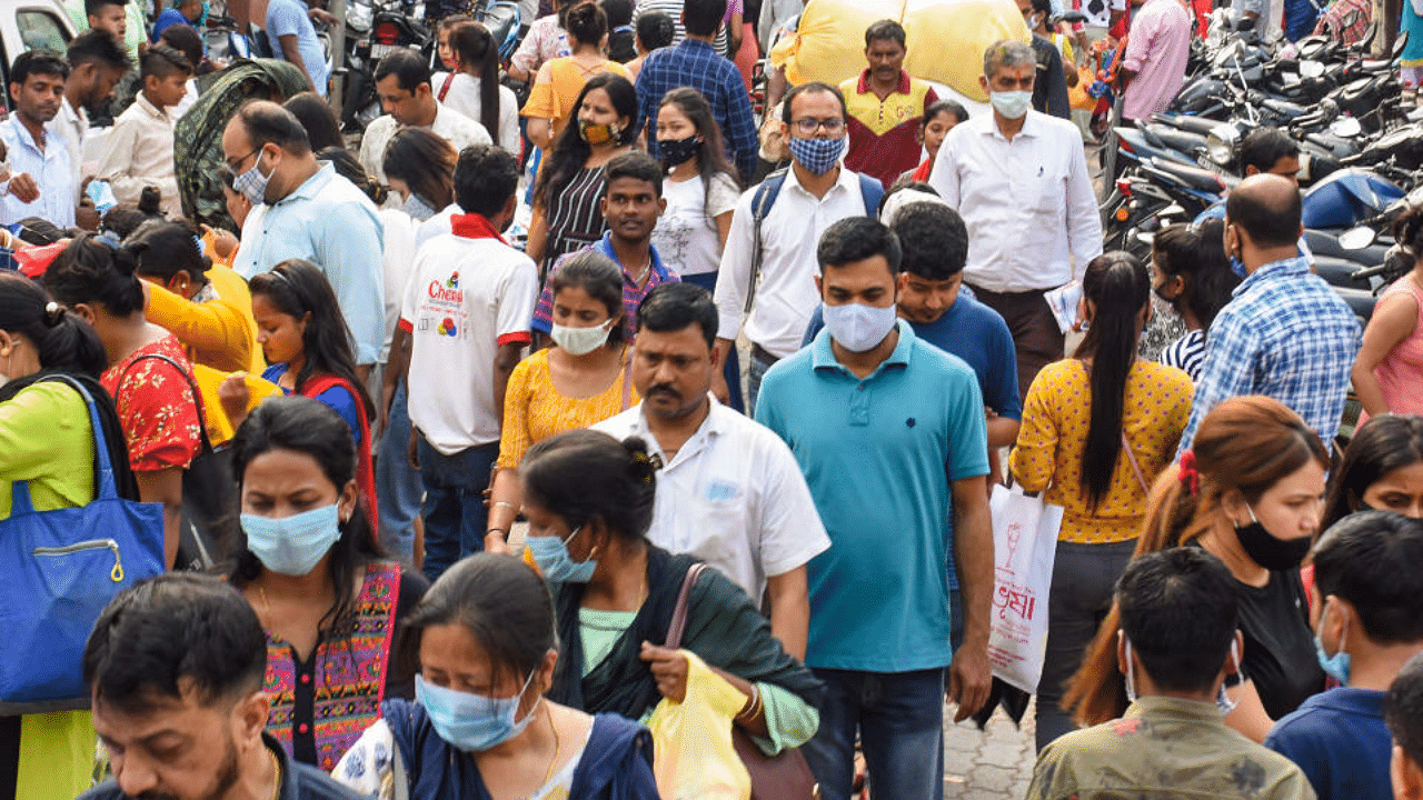 People, not adhering to social distancing norms, throng Fancy Bazar, ahead of the Rongali Bihu festival, amid coronavirus pandemic, in Guwahati, Friday, April 9, 2021. Credit: PTI Photo