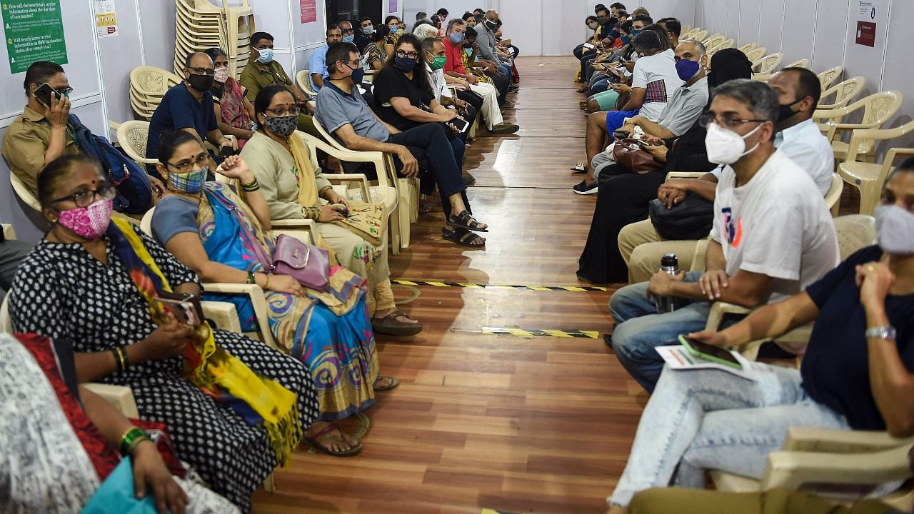People wait for their turn to receive a dose of Covid-19 vaccine, as coronavirus cases surge in Mumbai, Saturday, April 10, 2021. Credit: PTI Photo