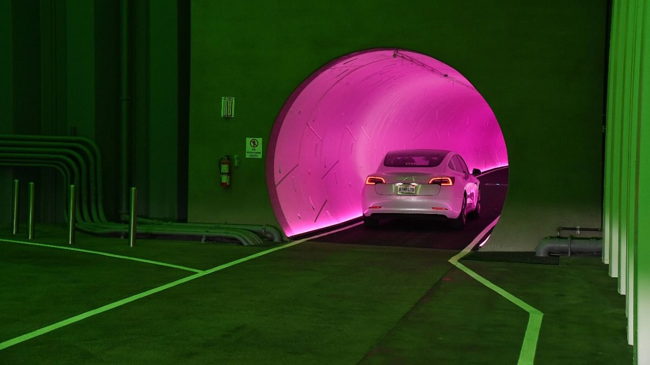  A Tesla car drives through a tunnel in the Central Station during a media preview of the Las Vegas Convention Center Loop on April 9, 2021 in Las Vegas, Nevada. Credit: AFP photo