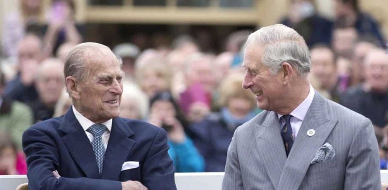 An old photo of Prince Phillip (L) with Prince Charles. Credit: Twitter/@ProRoyalFamily