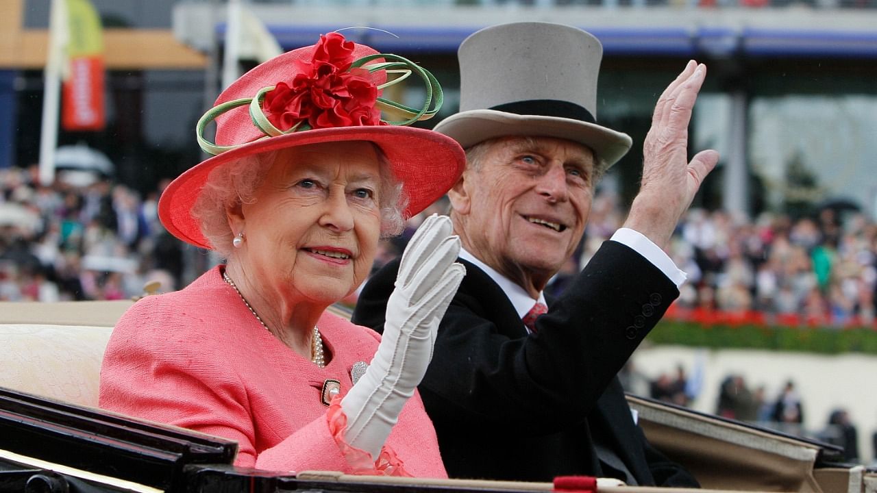 In this Thursday June, 16, 2011 file photo Britain's Queen Elizabeth II with Prince Philip arrive by horse drawn carriage in the parade ring on the third day, traditionally known as Ladies Day, of the Royal Ascot horse race meeting at Ascot, England. Credit: AP/PTI file photo.