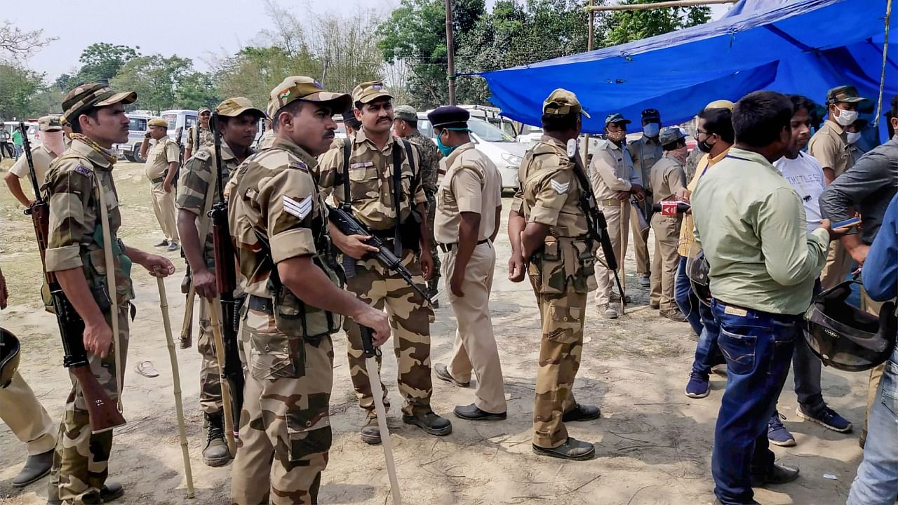 Security personnel keep vigil at a polling station after Election Commission ordered of stopping the voting exercise at polling station number 126 in Sitalkuchi, where clashes erupted between locals and central forces, at Sitalkuchi in Cooch Behar district, Saturday, April 10, 2021. Credit: PTI Photo
