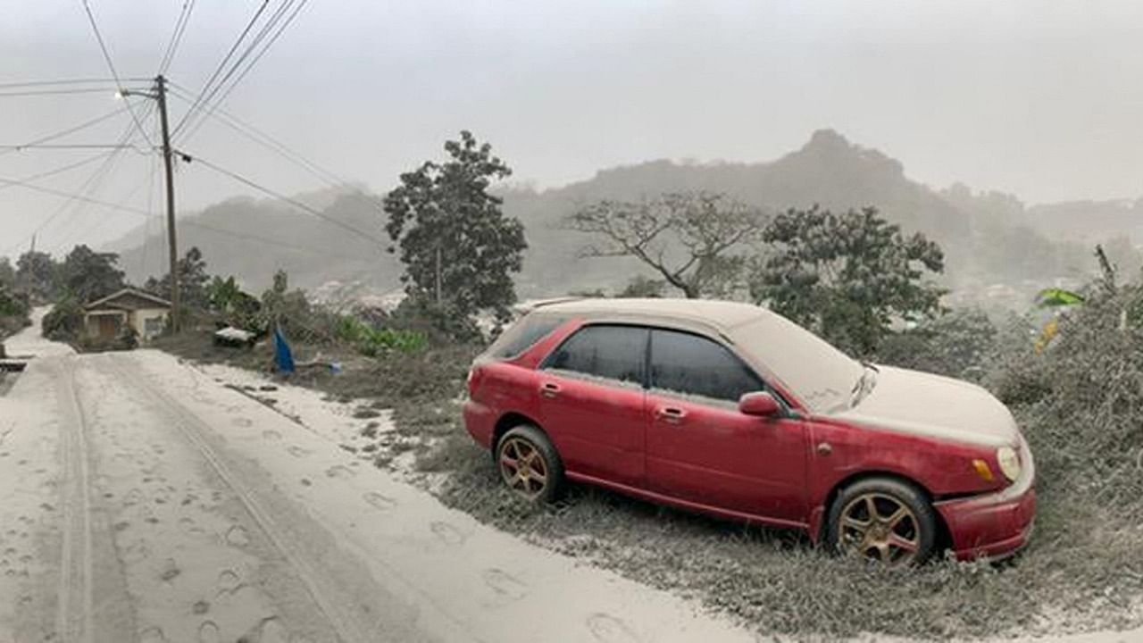 This April 10, 2021, handout image courtesy of the UWI Seismic Research Centre shows a car and road covered in ash after the April 9 eruption of the La Soufriere Volcano. Credit: UWI Seismic Research Centre / AFP photo