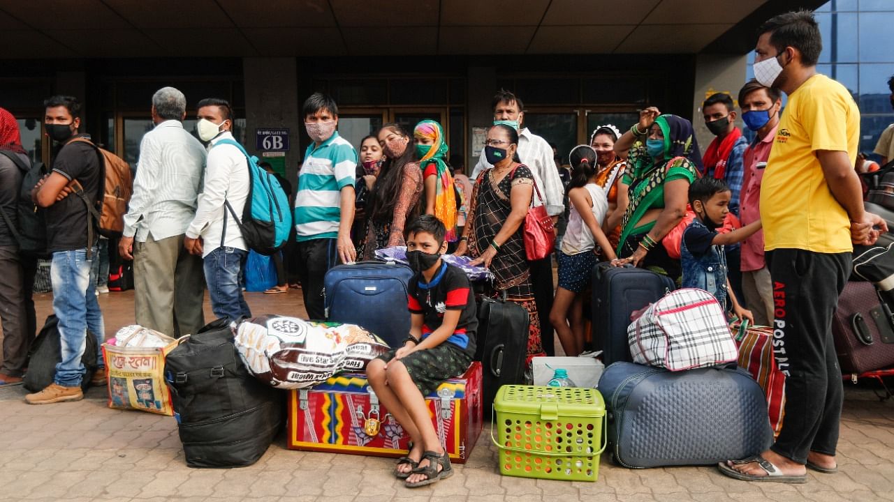 People wearing protective masks wait in line at a railway station amidst the spread of the coronavirus disease (Covid-19) in Mumbai, India, April 11, 2021. Credit: Reuters Photo