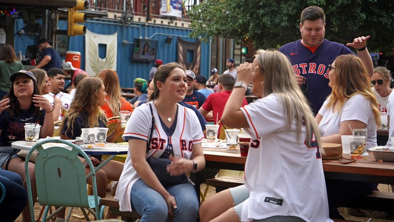 People drink and eat at Truck Yard beer garden in Houston, Texas, on April 9, 2021. Credit: AFP Photo