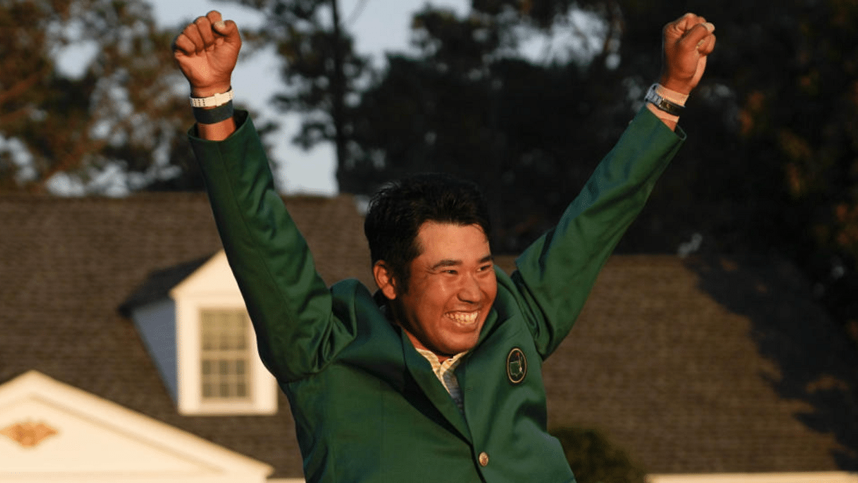 Hideki Matsuyama, of Japan, celebrates during champion's green jacket ceremony after winning the Masters golf tournament on Sunday, April 11, 2021, in Augusta, Ga. Credit: AP Photo