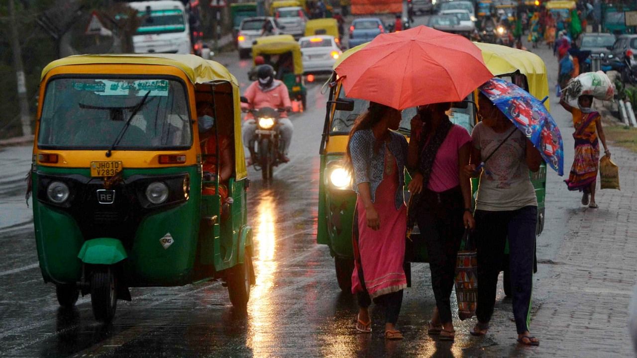 People use umbrellas during rain, in Ranchi. Credit: PTI File Photo