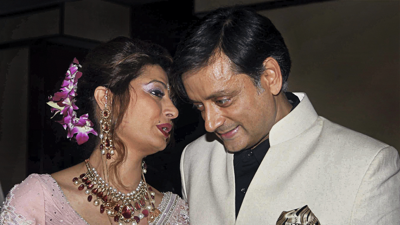 Congress MP Shashi Tharoor with his wife Sunanda Pushkar at their reception party in New Delhi. Credit: PTI File Photo