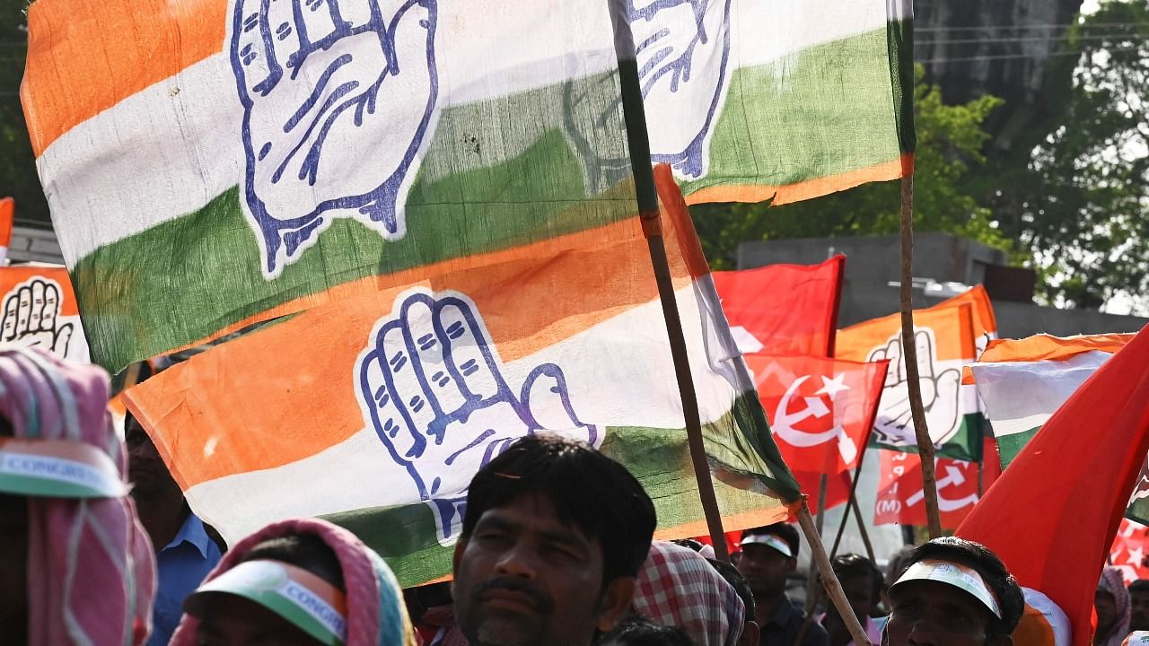 Activists of the Congress and the Left parties participate in the last campaign rally for the United Front candidate before the first phase of West Bengal's state legislative Assembly election in Purulia, some 325 km west of Kolkata on March 25, 2021. Credit: AFP File Photo