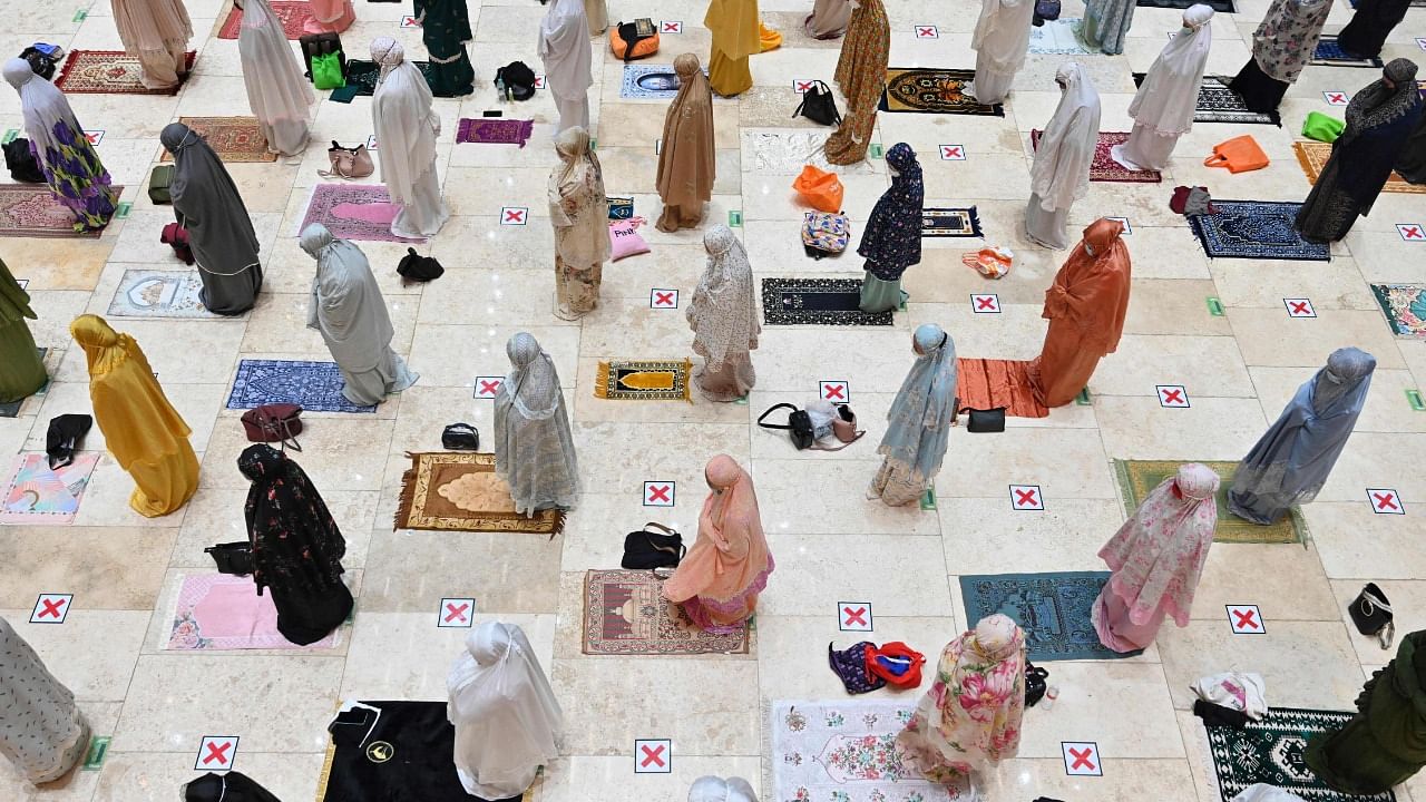 Muslim women offer prayers on the first night of Ramadan at the Istiqlal grand mosque in Jakarta. Credit: AFP Photo
