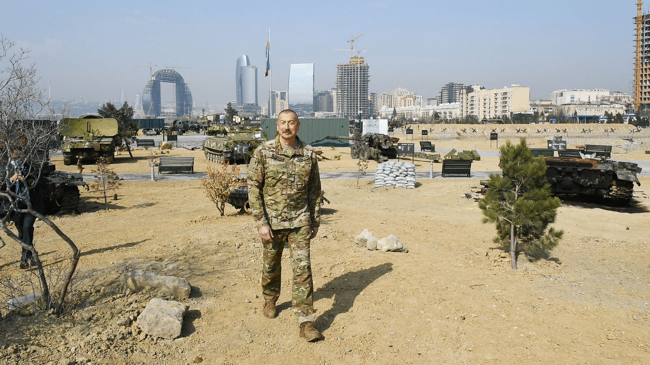 Azerbaijani President Ilham Aliyev tours the Military Trophy Park that showcases military equipment seized from Armenian troops during the last year war. Credit: AFP Photo