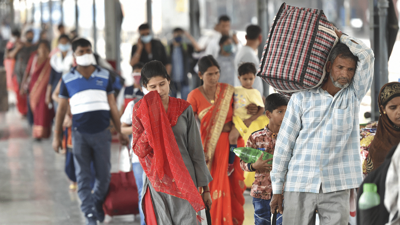 Passengers flout Covid-19 guidelines at Lucknow station. Credit: PTI Photo