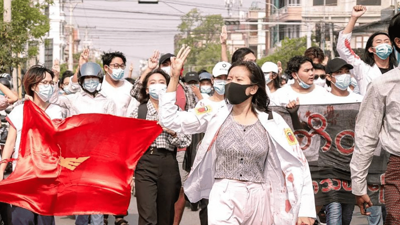 This photo taken and received courtesy of an anonymous source via Facebook on April 14, 2021 shows protesters marching during a demonstration against the military coup in Mandalay. Credit: AFP Photo