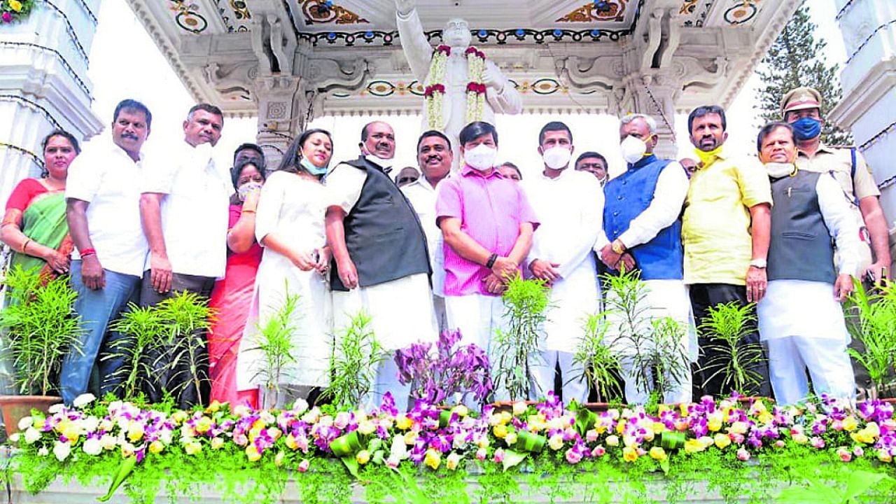 District In-charge Minister S T Somashekar pays floral tributes to the statue of B R Ambedkar near Rangacharlu Town Hall in Mysur, on Wednesday. MLA S A Ramadass, MP Pratap Simha and MLA L Nagendra are seen. Credit: DH Photo