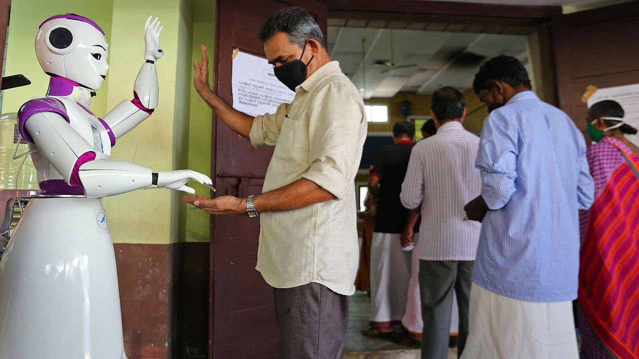 A robot dispenses sanitizer as a preventive measure against the Covid-19 pandemic. Credit: AFP Photo