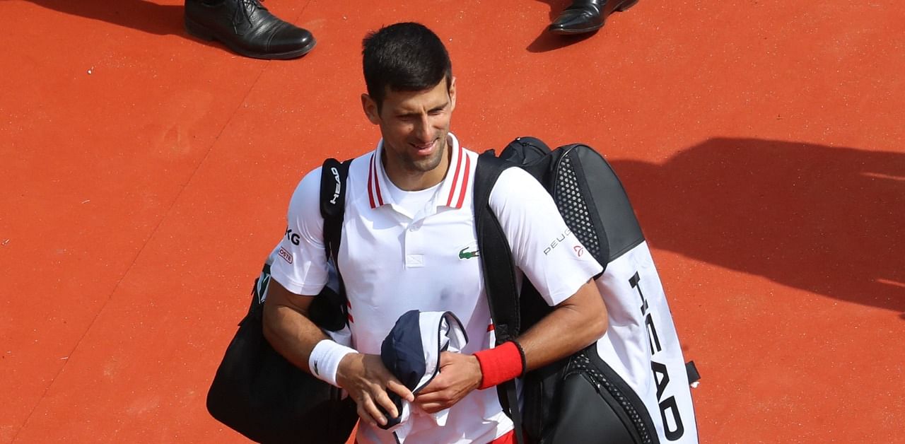 Serbia's Novak Djokovic leaves the court after his defeat in his third round singles match against Britain's Daniel Evans on day six of the Monte-Carlo ATP Masters Series tournament in Monaco on April 15, 2021. Credit: AFP Photo