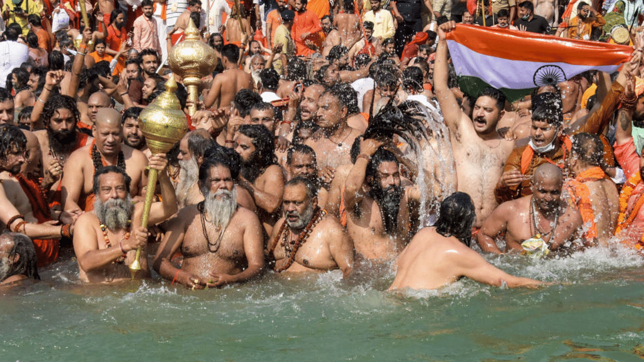 Devotees gather to offer prayers during the third 'Shahi Snan' of the Kumbh Mela 2021, at Har ki Pauri Ghat in Haridwar, Wednesday, April 14, 2021. Credit: PTI Photo