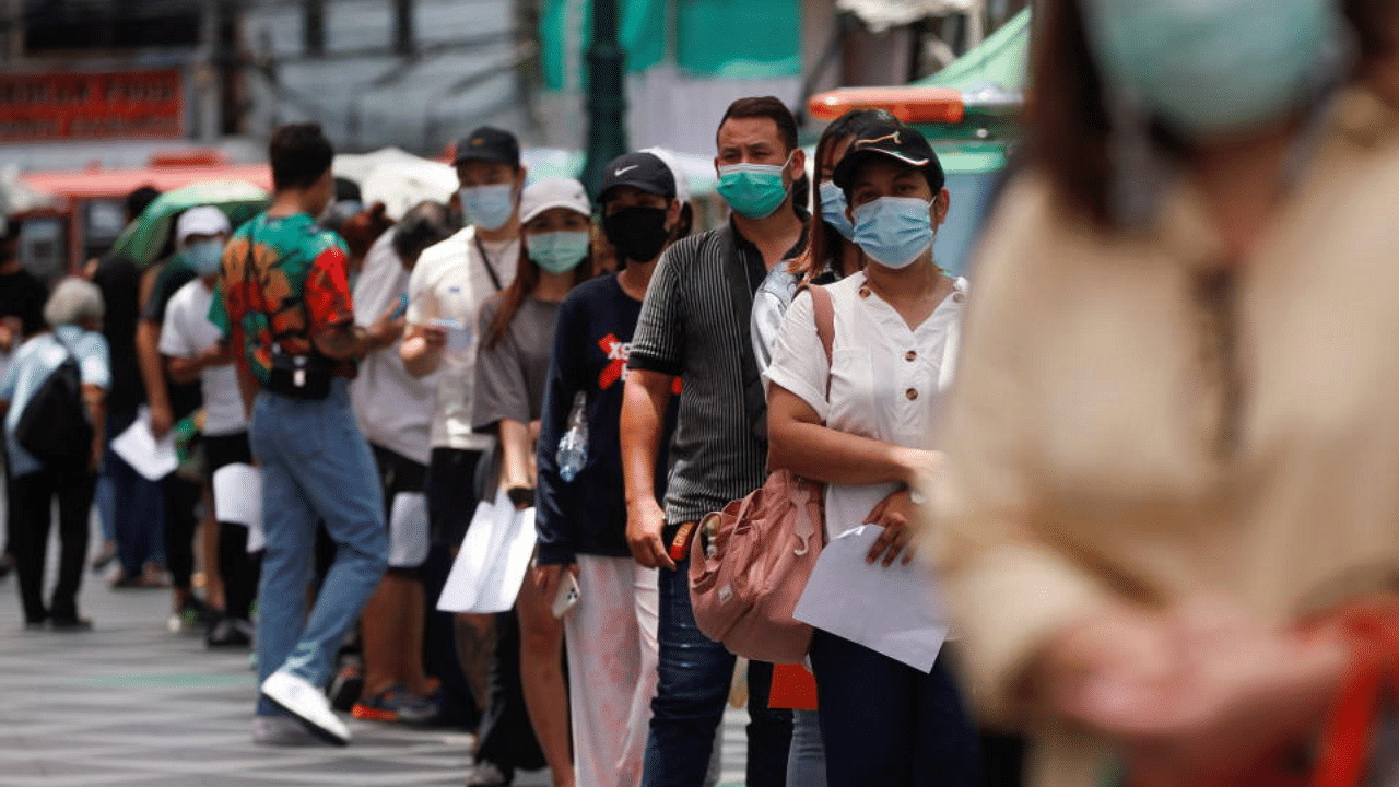 Local residents queue for a coronavirus disease nasal swab test, in Bangkok, Thailand, April 14, 2021. Credit: Reuters Photo