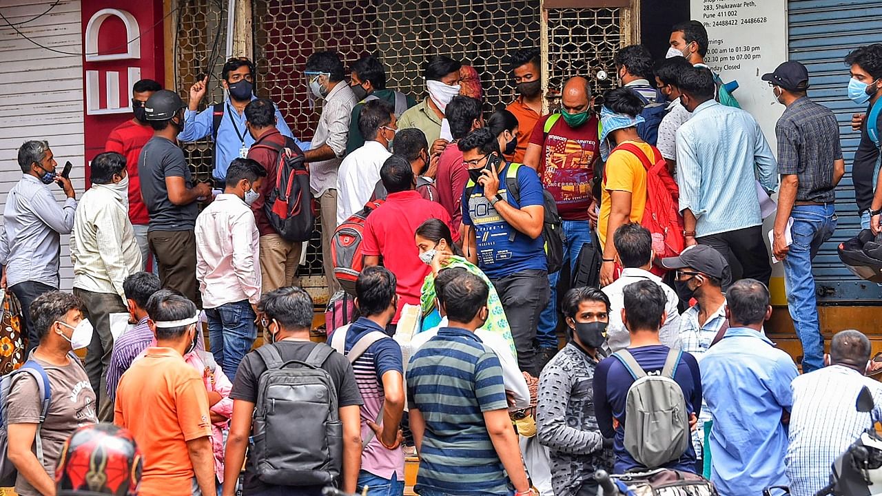 Huge crowd outside the office of Chemists Association during a protest, demanding the necessary Remdesivir injections for the treatment, in Pune, Friday, April 9, 2021. Credit: PTI Photo