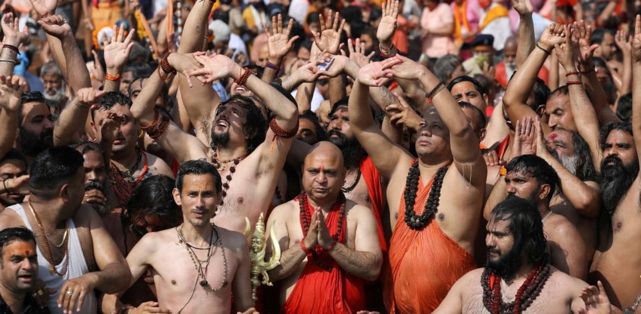 Sadhus, or Hindu holy men take a holy dip in the Ganges river during Shahi Snan at "Kumbh Mela", or the Pitcher Festival, amidst the spread of the coronavirus disease (Covid-19), in Haridwar, India, April 14, 2021. Credit: Reuters Photo