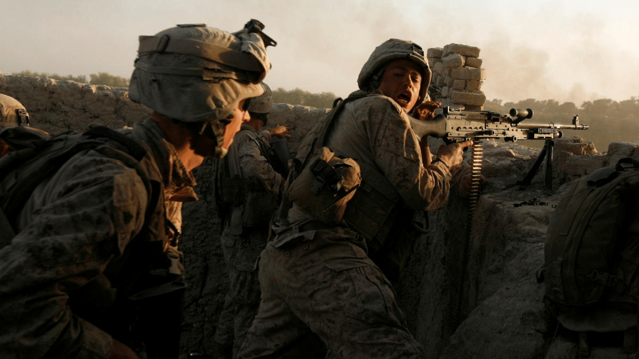 US Marines fire during a Taliban ambush. Credit: Reuters file photo. 