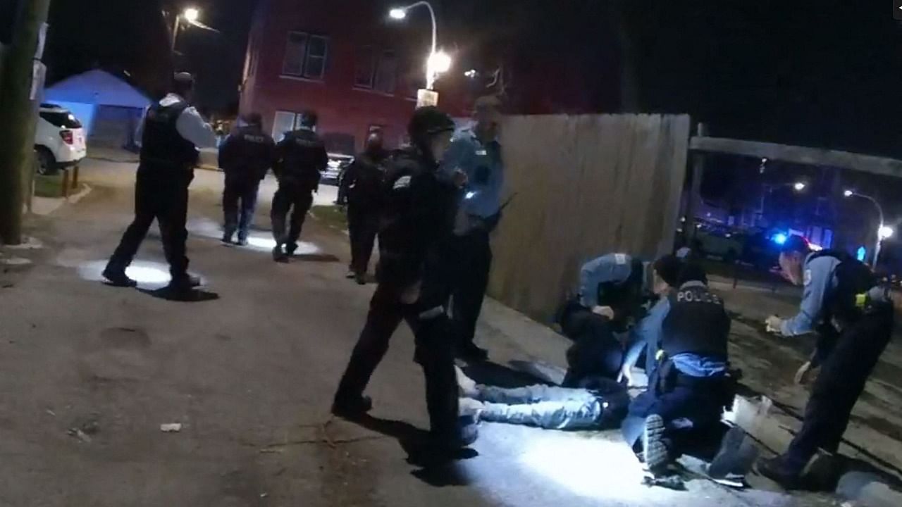 This video police body cam image released by the Civilian Office of Police Accountability (COPA) on April 15, 2021, shows a frame grab of 13 year-old Adam Toledo on the ground after he was shot by police in Chicago. Credit: AFP Photo/Civilian Office of Police Accountability (COPA)/Handout