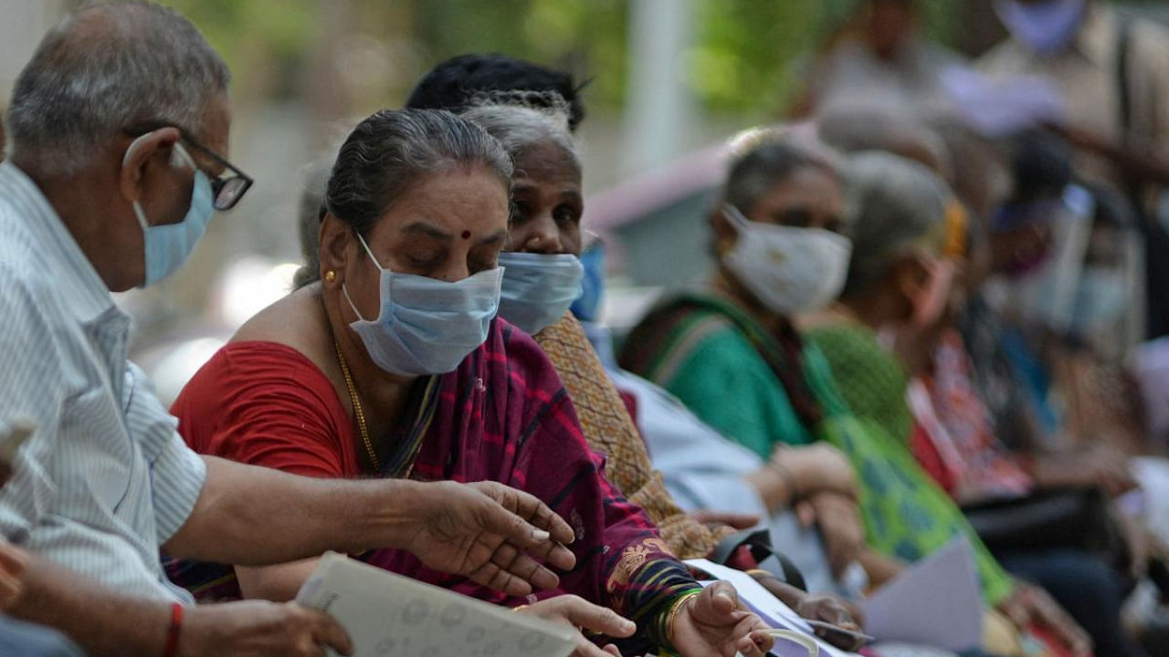 People wait for their turn to receive the coronavirus vaccine at a government hospital in Chennai. Credit: AFP photo. 