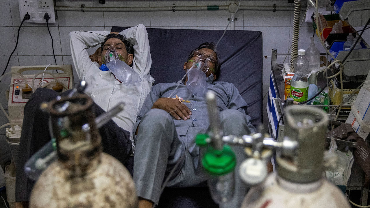 Patients suffering from Covid-19 get treatment at the casualty ward in Lok Nayak Jai Prakash Hospital in Delhi. Credit: Reuters Photo