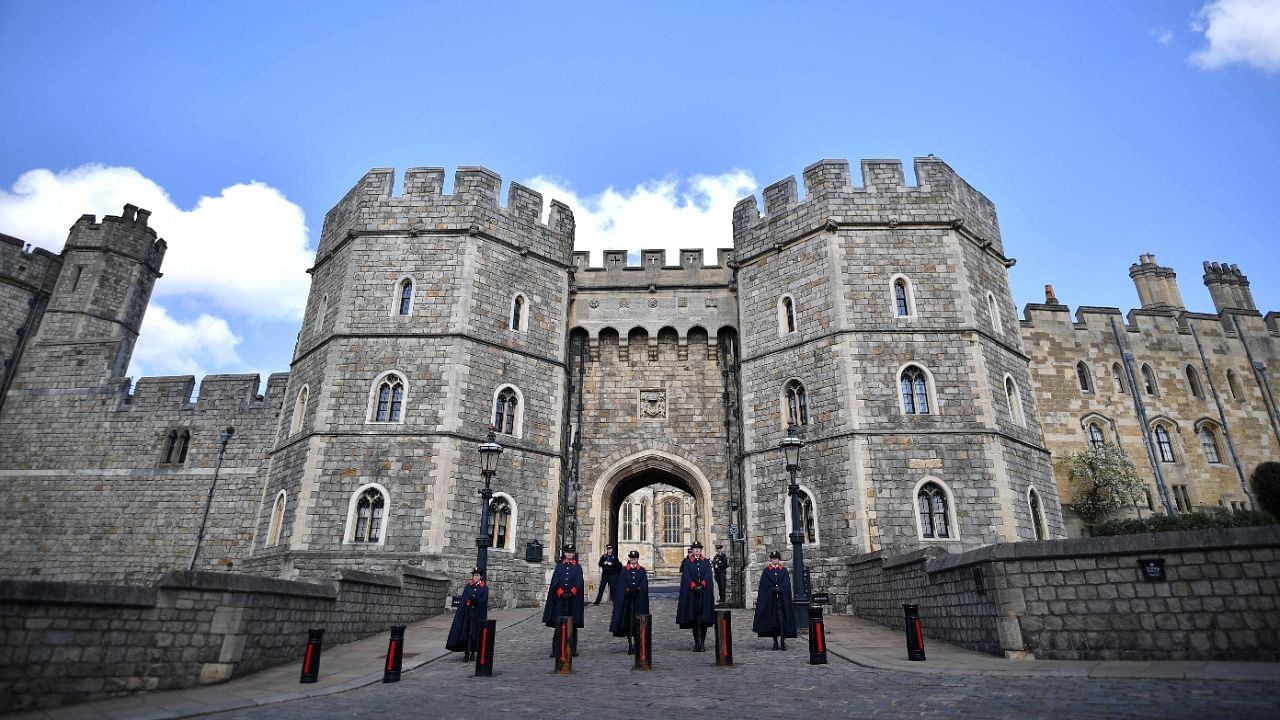 Wardens stand at the entrance to Windsor Castle in Windsor, west of London, on April 16, 2021, following the April 9 death of Britain's Prince Philip, Duke of Edinburgh, at the age of 99. Credit: AFP Photo